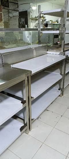 preparation table under counter shelves, deep fryer, pizza oven, avail 0