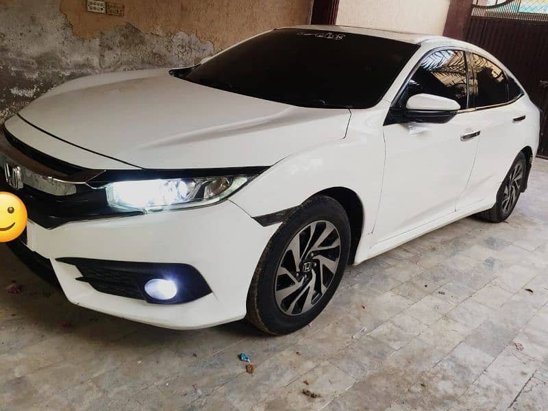 Honda Civic VTi Oriel 2016 white Lahore number 033/69-800/157 2