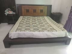 a solid sheesham low profile bed with 8 inch spring mattress.