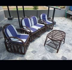 cane sofa set and table