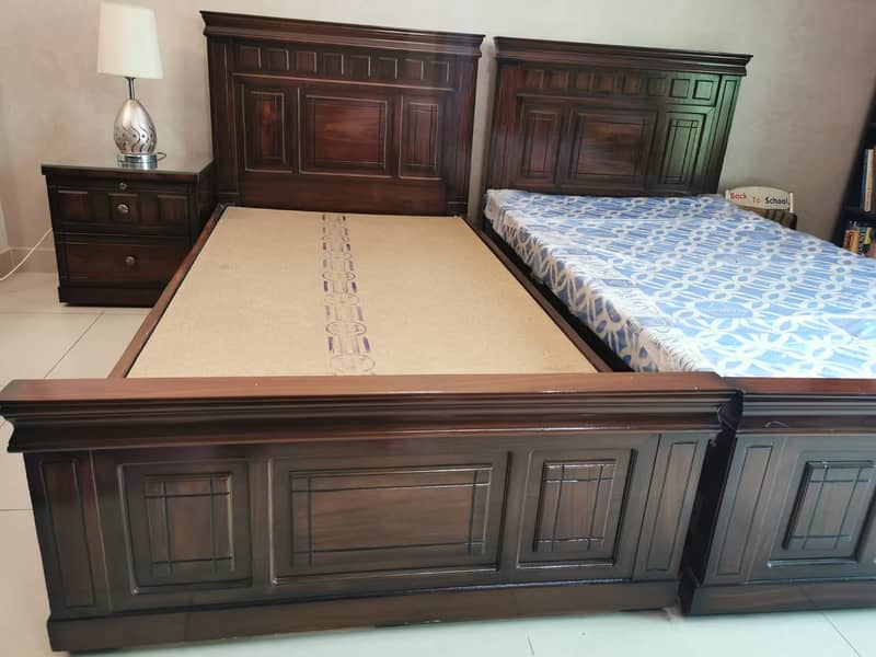 Two Single Beds (almost new) with one mattress alongwith side table 1