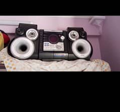 set of speakers and CD player 0