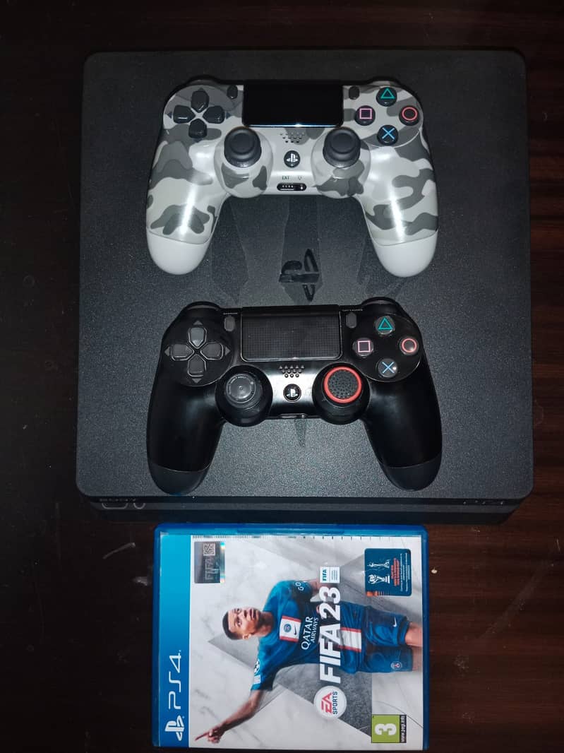 PS4 Slim 500gb with 2 controllers and FIFA 23 0