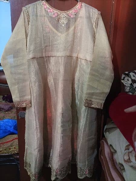 3 piece embroidery dress,net shirt, net dupatta,silk trouser. 1