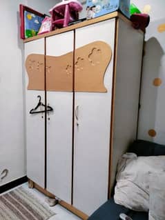 Single bed and triple wardrobe