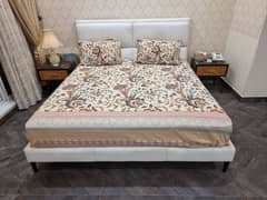 Leather bed with mattres, 4 pillows, and 2 sitetable