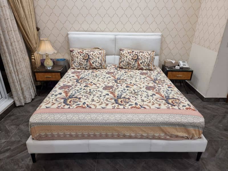 Leather bed with mattres, 4 pillows, and 2 sitetable 3