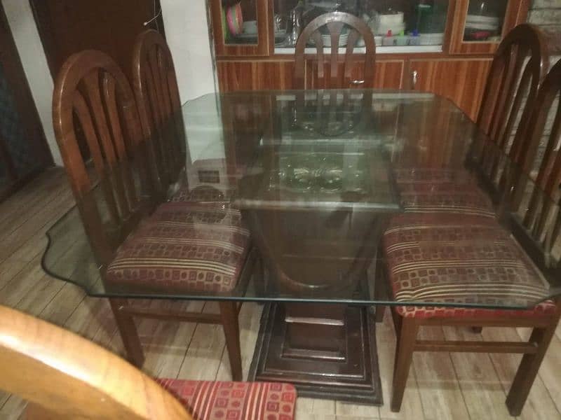 dinning table with glass top and 6 chairs 4