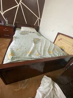 2 single beds with side tables and dressing table
