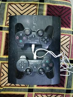 PS3 console and 2 remotes of Dualshock 3