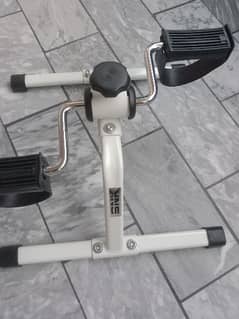 Pedal exerciser and twister plate