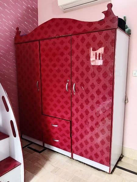 Red Wardrobe made up of Acrylic sheet with glass upper cover 0