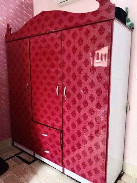 Red Wardrobe made up of Acrylic sheet with glass upper cover 1