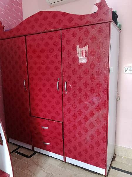 Red Wardrobe made up of Acrylic sheet with glass upper cover 2