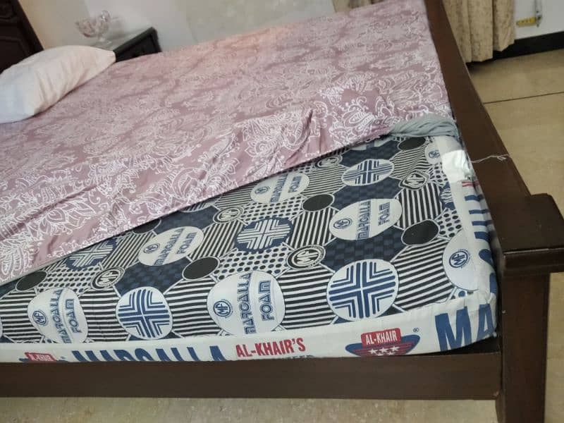 wooden bed with side table and mattress 4