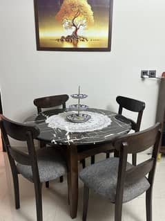 Wooden dinning table with four chairs