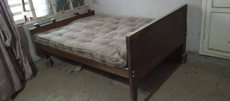 wooden double bed 0
