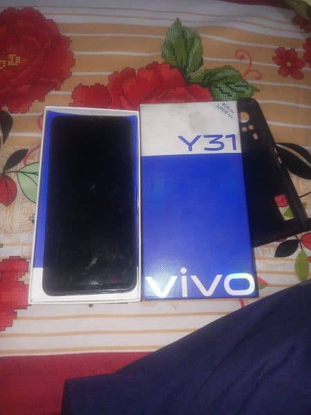 vivo y31 4 \128 ram  with charger and box condition 10 by 10 3