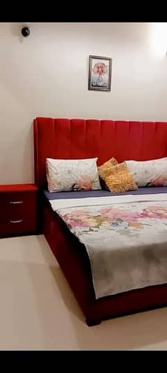 king size bed with side table and without mattress