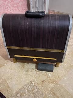 Sewing machine with wooden cover