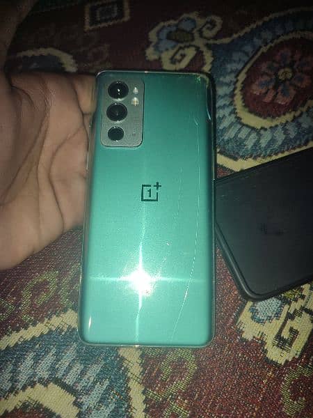 One Plus 9RT 5G ORIGNAL PTA APPROVED WITH ORIGNAL CHARGER AND HANDFREE 1