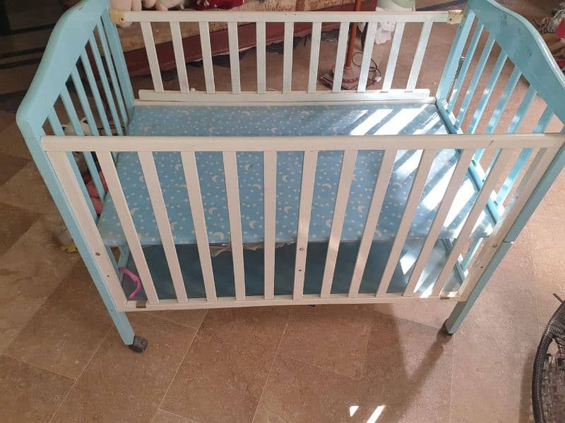 Baby cot with double shelf and tyres 1