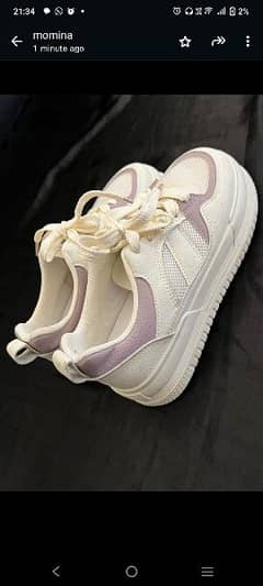 white and purple shoes
