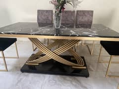 Marble dining table with 8 dining chairs.