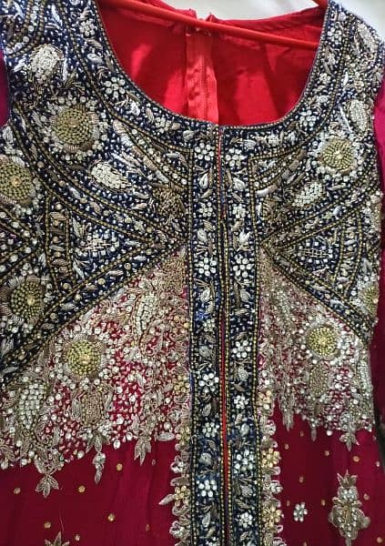 Beautiful Red Bridal Wear With Blue Touch Of Designing 13