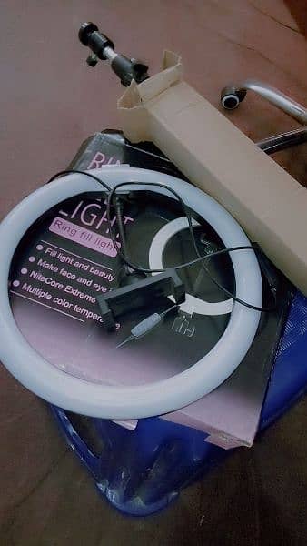 Ringlight with stand it has three colours and in best condition 1