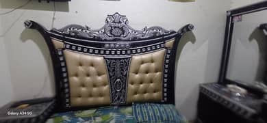 double bed black and silver color with 2 side table and drassing