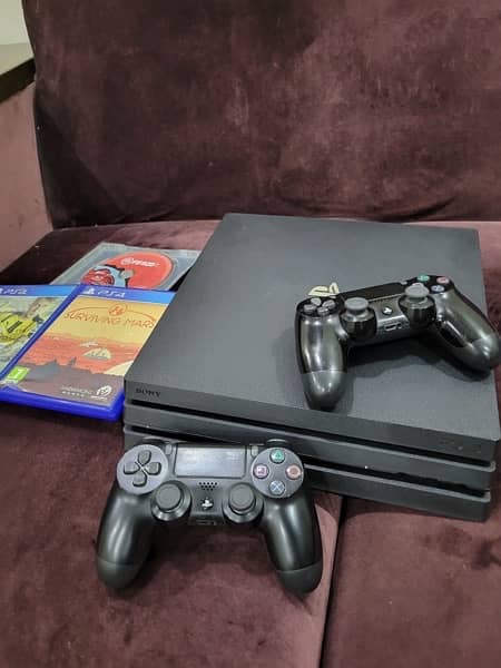 ps4 pro with 2 controlers and 3 games 0