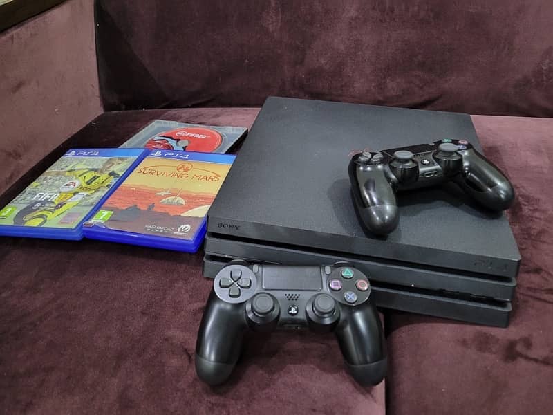 ps4 pro with 2 controlers and 3 games 2