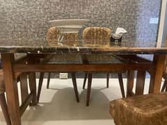 Beautiful Marble top pure wooden base dinning table.