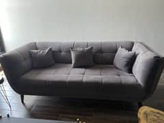 Grey velour sofa 0
