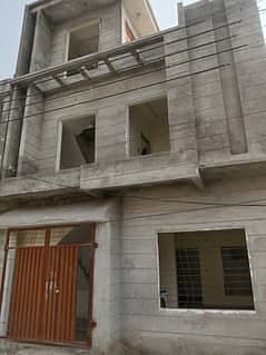 H-13 Double story grey structure House For sale Top Location