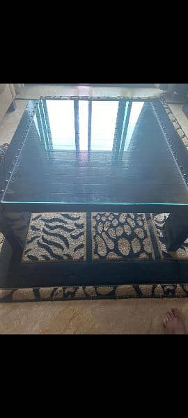 Dark brown wooden center table with glass top 1