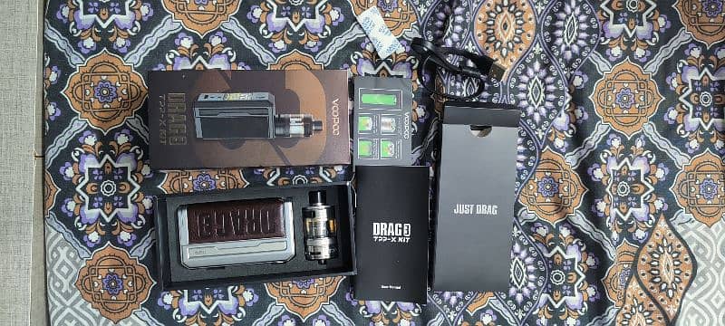 Drag 3 vape with 100ml pop flavr, 177 watt, with complete accessories. 3