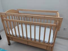 Baby Cot with one lift panel. Mattress included.