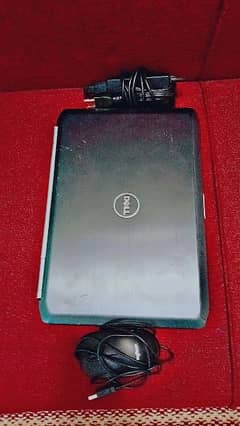 Dell laptop with mouse and charger