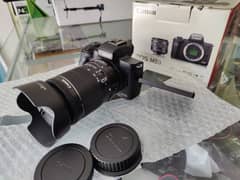 Canon M50 with adopter and 18-55mm STM lens