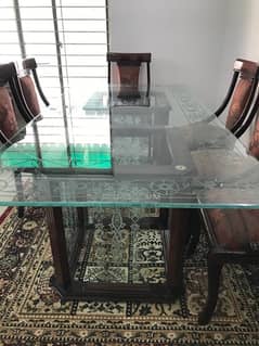 Good condition dinning table with 8 chairs