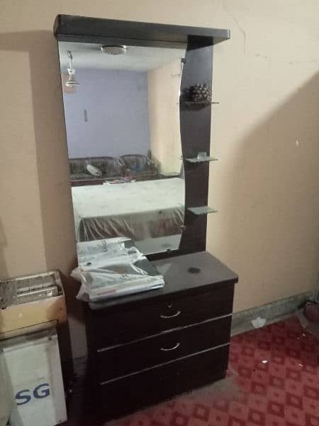 bed with 2 side table and a dressing table. 1