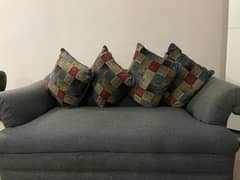 plain sofa with printed cushions