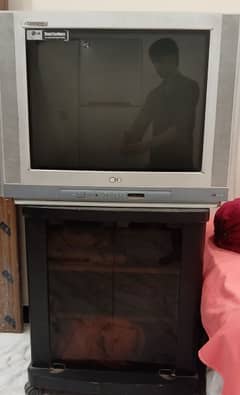 LG large Television and wooden Trolley. .