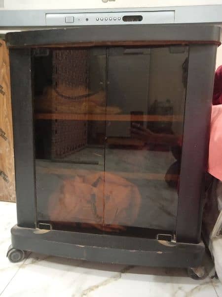 LG large Television and wooden Trolley. . 1