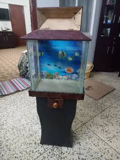 Fish aquarium with wooden stand.