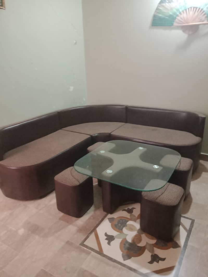 Table with 4 seat's stools L shape sofa. 1