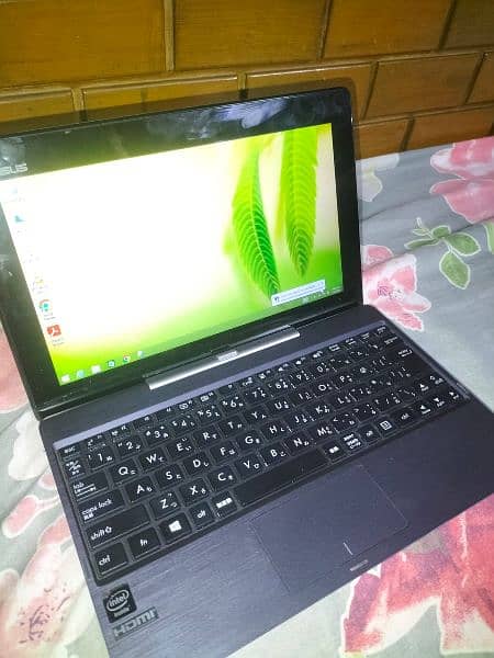 ASUS MINI 2 IN 1 LAPTOP 0