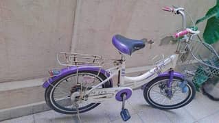 Girls cycle with basket